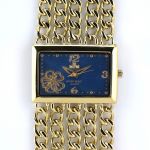 Dámské společenské hodinky na řemínku z řetízků. Číselník je zdobený květinkou..0386 170755 Hodiny